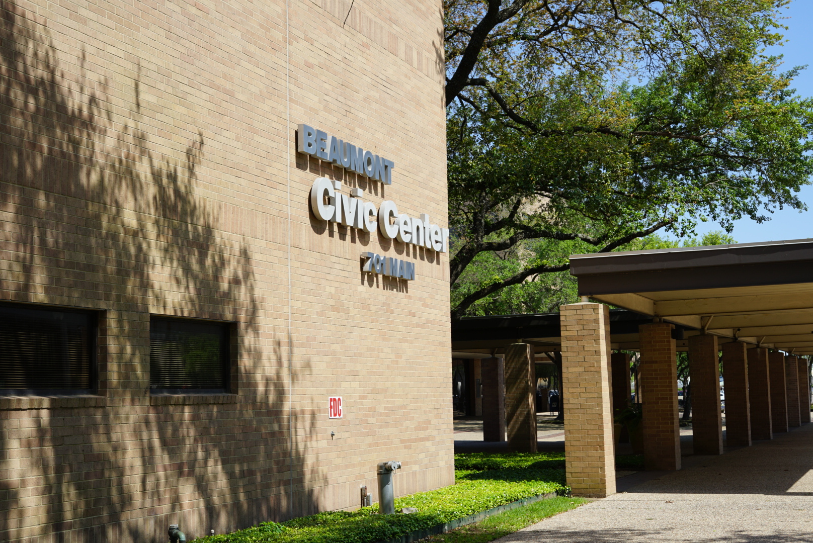 Beaumont Civic Center building facade with trees and covered walkway